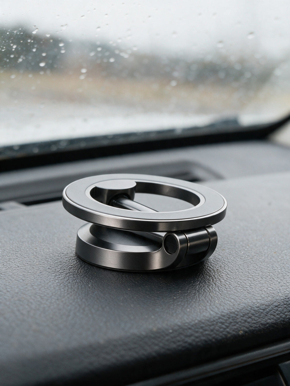Magnetic Car Phone Mount — folded flat on the dashboard