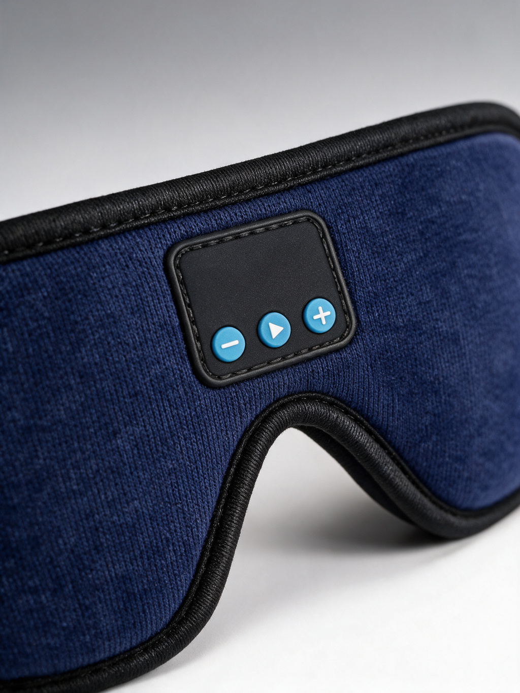 Bluetooth Sleep Mask — close-up of the volume and play buttons
